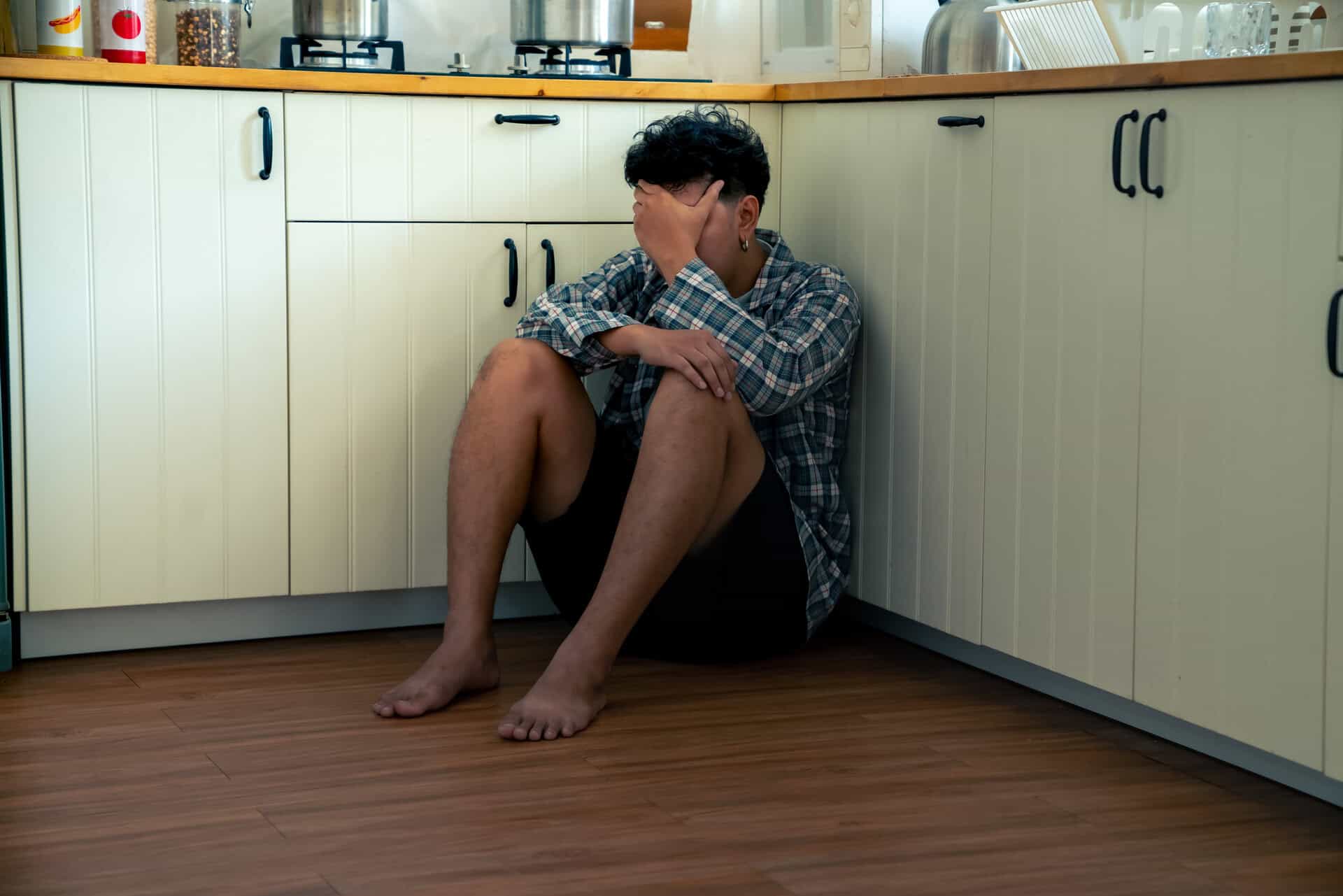 Individual struggling with alcohol withdrawal seeking help and support