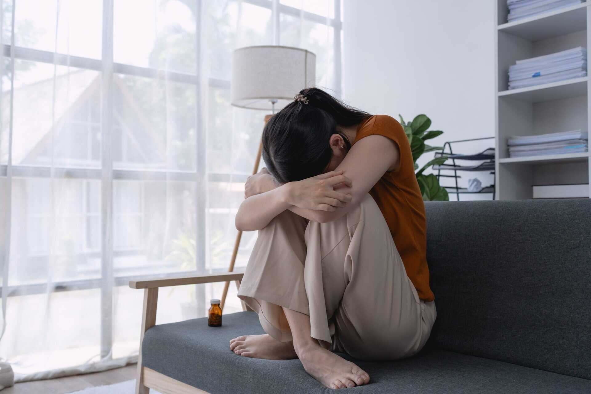 Woman experiencing emotional distress related to alcohol addiction seeking support