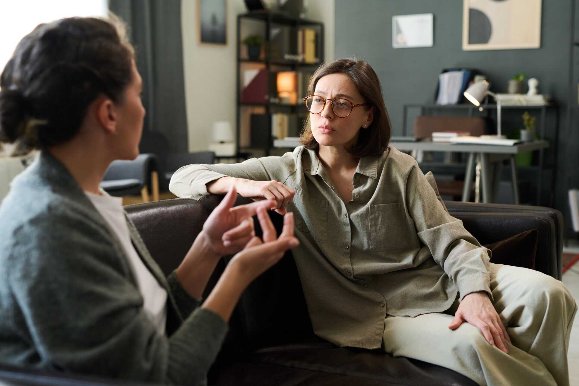 Supportive therapy session celebrating progress in addiction recovery